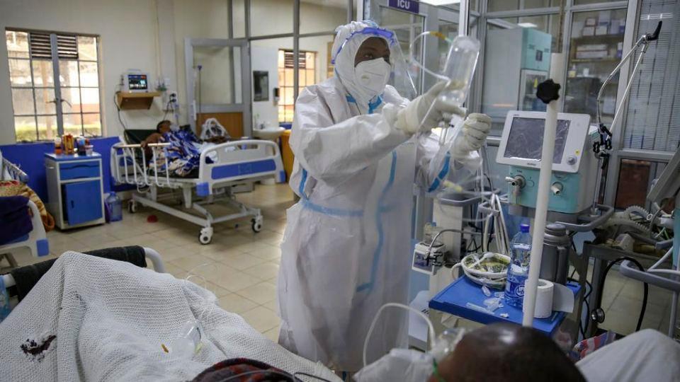 A medical worker attends to a coronavirus patient in the intensive care unit of an isolation and treatment center for those with COVID-19 in Machakos, south of the capital Nairobi, in Kenya Tuesday, Nov. 3, 2020. As Africa is poised to surpass 2 million confirmed coronavirus cases it is Kenya’s turn to worry the continent with a second surge in infections well under way. (AP Photo/Brian Inganga)