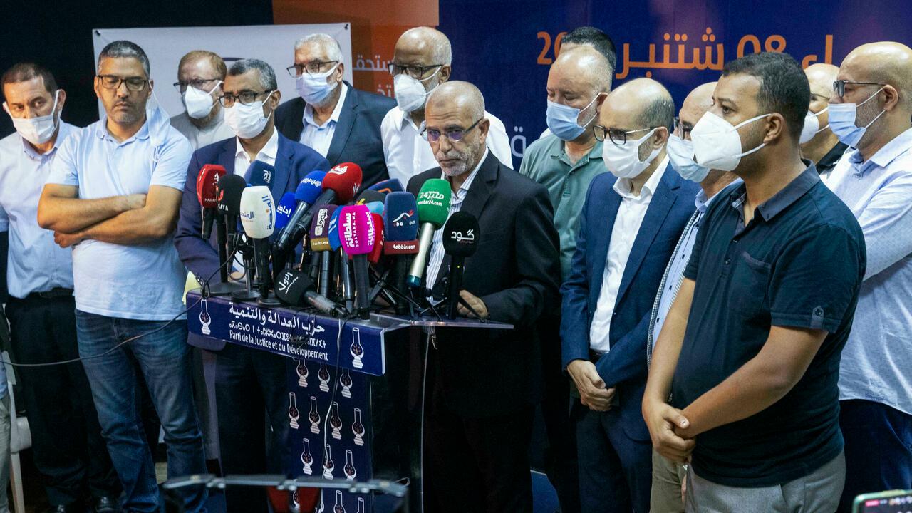 Members of Morocco’s Islamist Justice and Development Party (PJD) hold a press conference in the capital Rabat to announce the resignation of its president Saad-Eddine el-Othmani and all members of its general secretariat, after it came in 8th in parliamentary and local elections, on September 9, 2021. – Morocco’s long-ruling Islamists have suffered a crushing defeat in parliamentary elections, coming far behind their main liberal rivals, the National Rally of Independents (RNI) and the Authenticity and Modernity Party (PAM) seen as close to the palace, according to provisional results. (Photo by FADEL SENNA / AFP)