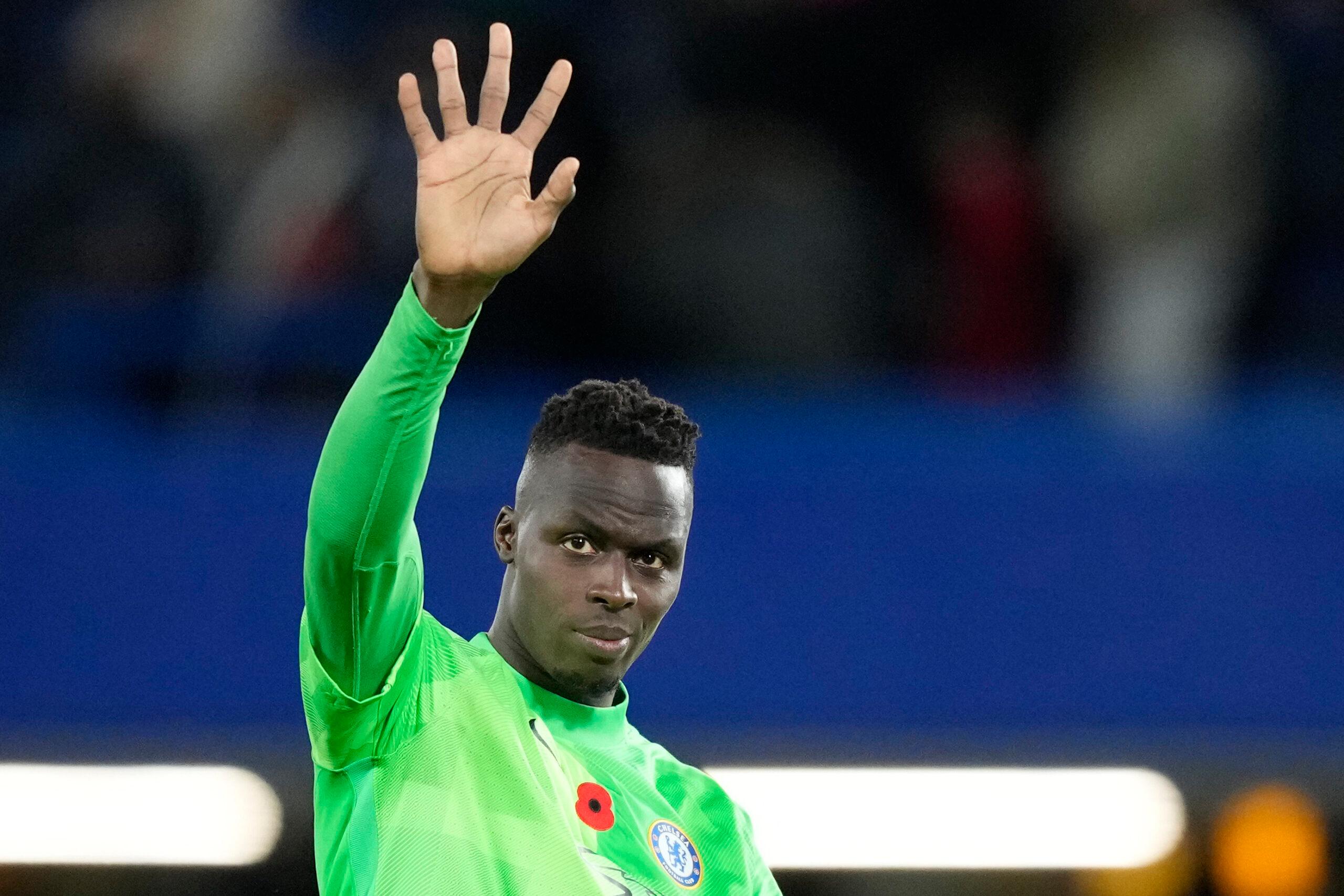 Chelsea’s goalkeeper Edouard Mendy greets supporters at the end of the English Premier League soccer match between Chelsea and Burnley at the Stamford Bridge stadium in London, Saturday, Nov. 6, 2021. (AP Photo/Frank Augstein)