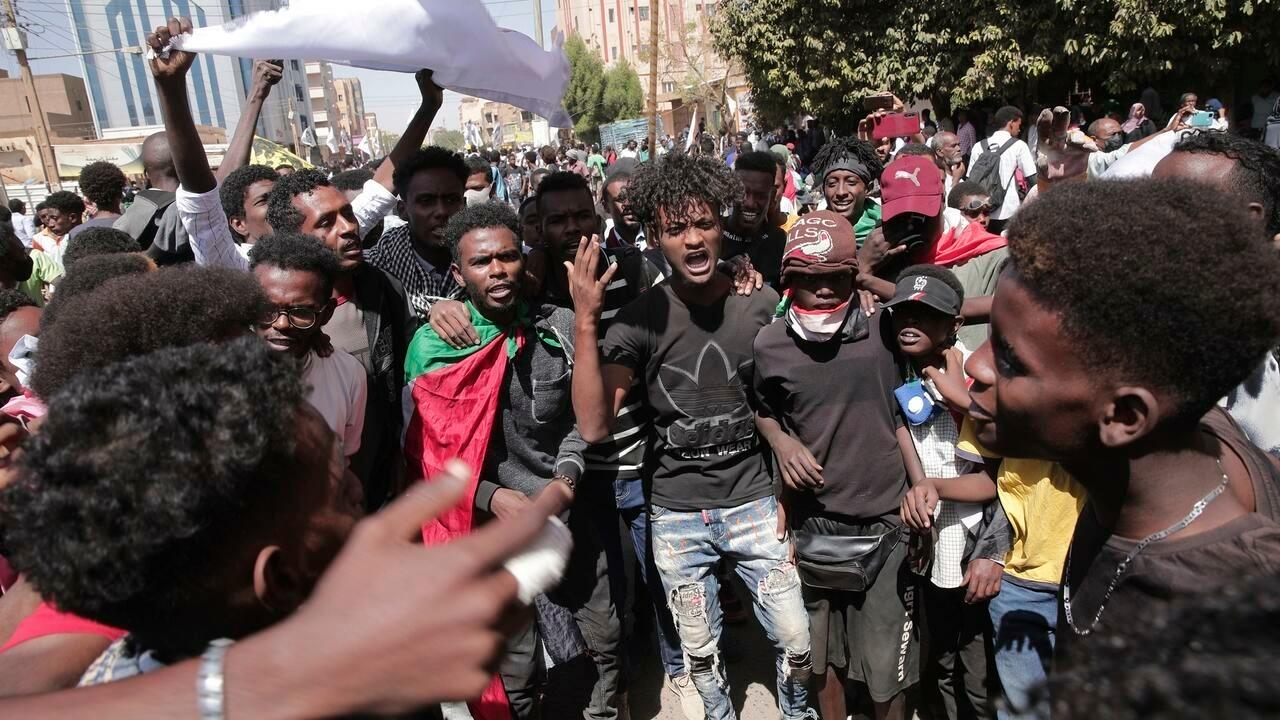 People chant slogans during a protest against last year’s military coup, in Khartoum, Sudan, Monday, Feb. 7, 2022. Since the coup, at least 79 people have been killed and hundreds of others wounded in a widely condemned crackdown on protests, according to the Sudan Doctors Committee, a medical group tracking casualties among protesters. (AP Photo/Marwan Ali