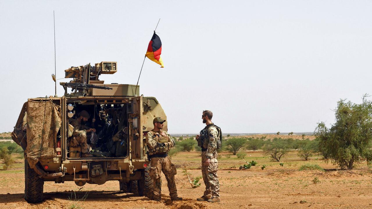 Germans soldiers from the parachutists detachment of the MINUSMA (United Nations Multidimensional Integrated Stabilization Mission in Mali) search for IED (improvised explosive device) during a patrol on the route from Gao to Gossi, Mali on August 2, 2018. (Photo by SEYLLOU / AFP)