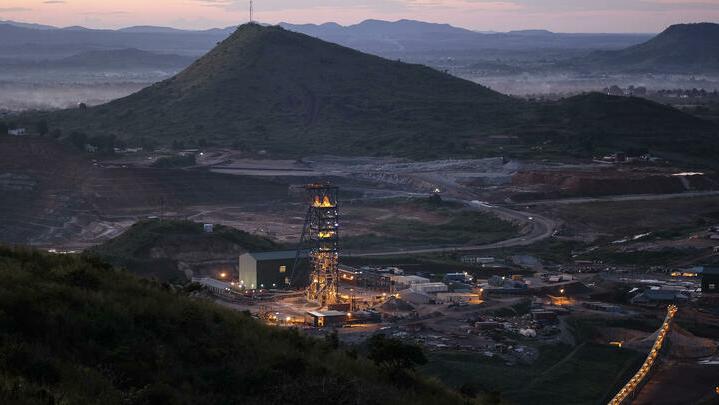 The mine shaft used to access underground excavation tunnels sits illuminated at a gold mine in Democratic Republic of Congo. Photographer: Simon Dawson/Bloomberg