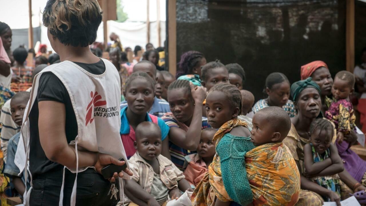 MSF staff with patients at MSF health post in Mpoko IDP camp at Bangui International Airport